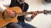 Man playing Gitarre with Cutaway 